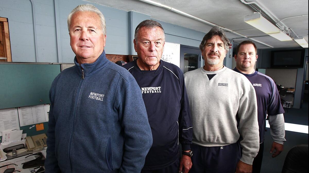 Matt Burns, on the far right, is a finalist for the Newport Harbor High football coaching job. Burns was an assistant for 20 years under-then Sailors coach Jeff Brinkley, on the left.