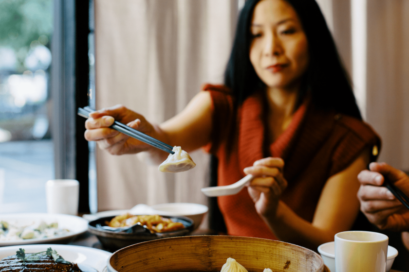 Woman enjoys dim sum