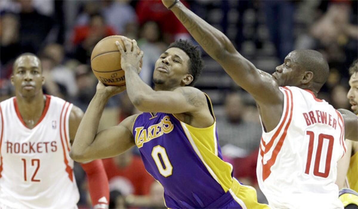 Nick Young looks to pass during the Lakers' loss to the Rockers, 113-99, last Wednesday.