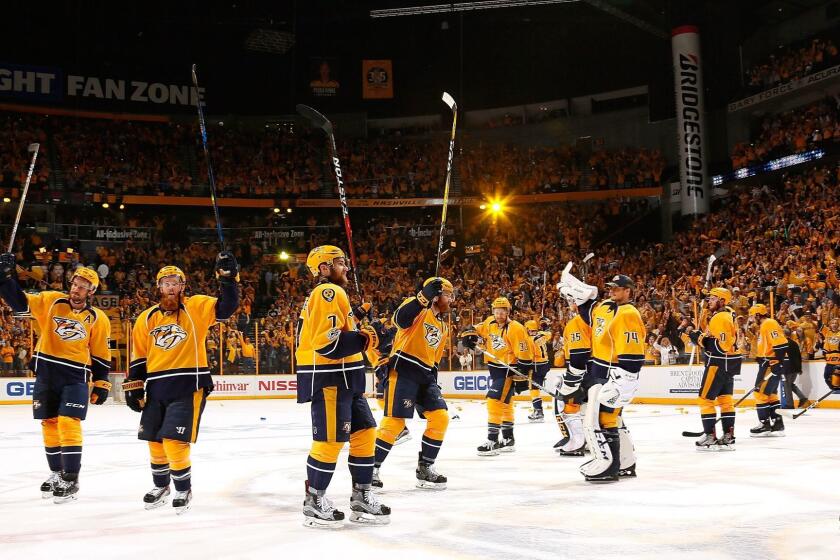 NASHVILLE, TN - MAY 07: The Nashville Predators raise their sticks to thank the fans after a 3-1 Predator victory over the St. Louis Blues in Game Six of the Western Conference Second Round during the 2017 NHL Stanley Cup Playoffs at Bridgestone Arena on May 7, 2017 in Nashville, Tennessee. (Photo by Frederick Breedon/Getty Images) ** OUTS - ELSENT, FPG, CM - OUTS * NM, PH, VA if sourced by CT, LA or MoD **
