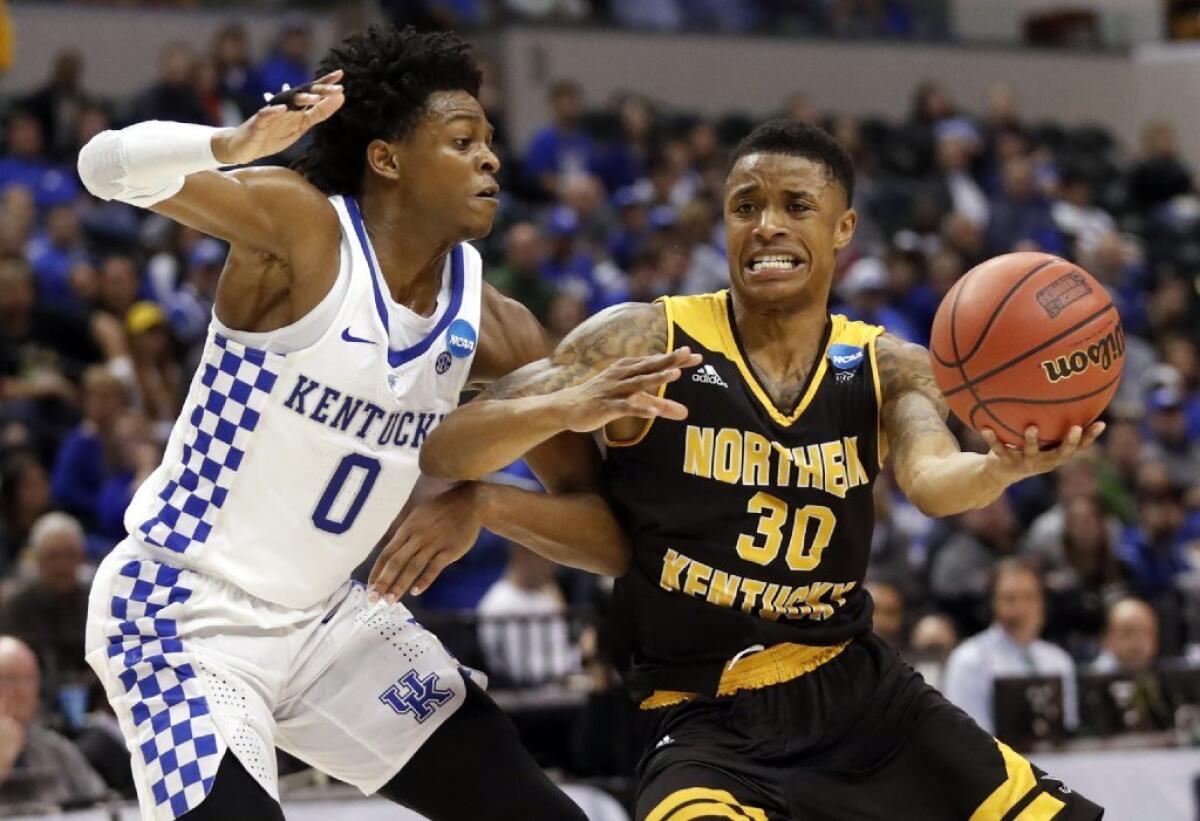 Northern Kentucky's Lavone Holland II heads to the basket past Kentucky's De'Aaron Fox during the second half of an NCAA tournament game on March 18 in Indianapolis.