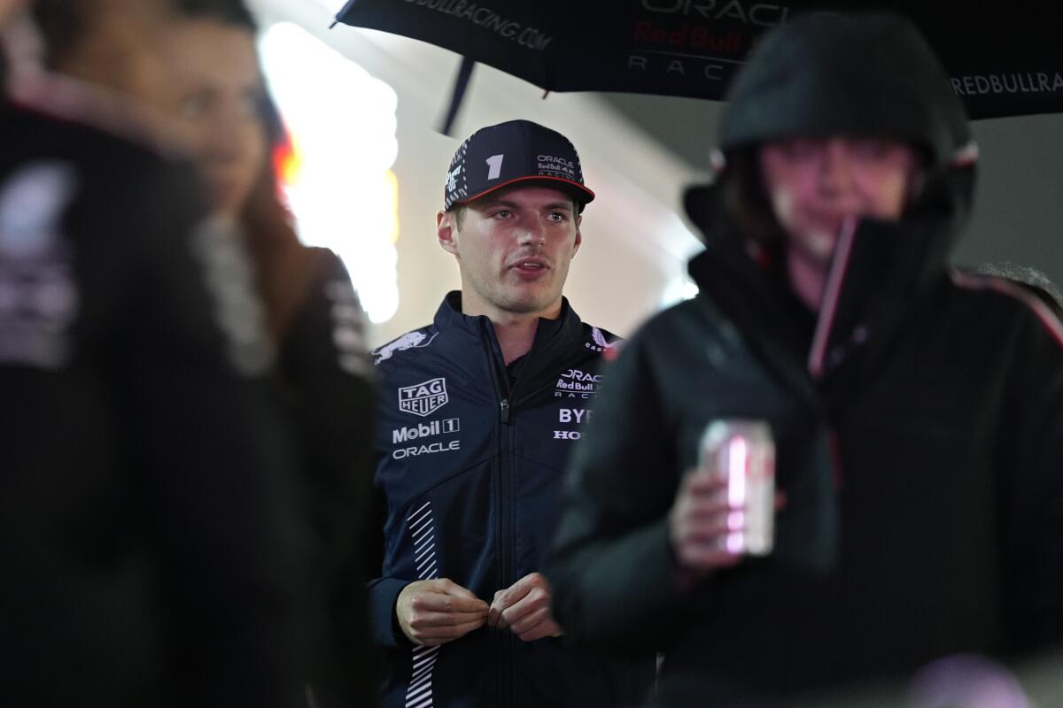 Three-time Formula One champion Max Verstappen walks in the paddock on Wednesday night.