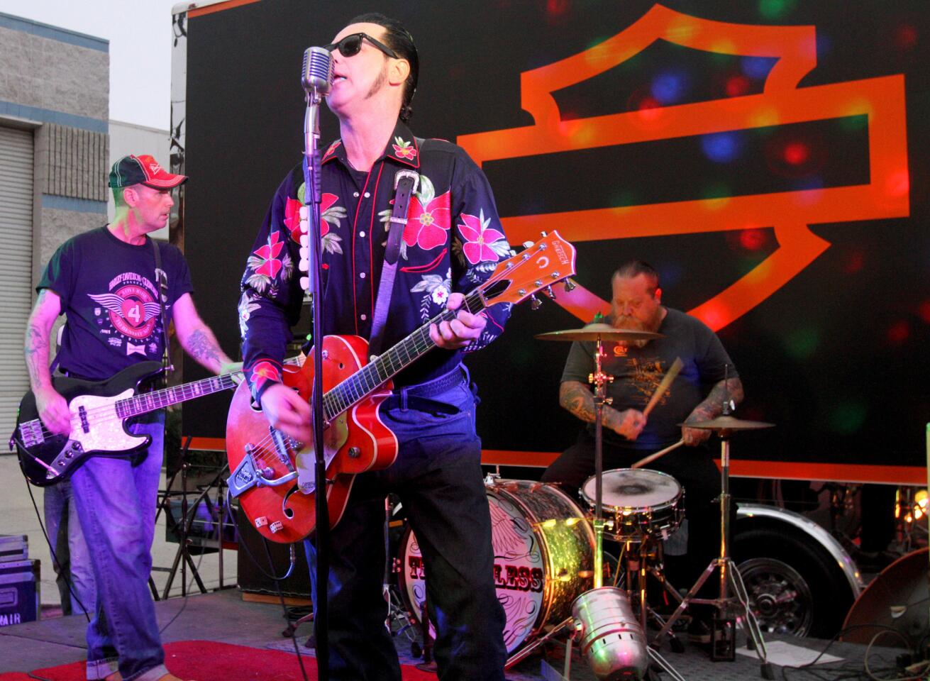 The Loveless lead singer Ernie Snair rocks the crowd gathered for the Pre-Love Ride Block Party at the Harley-Davidson Motorcycles store in Glendale on Friday, October 16, 2015. The 32nd and final Love Ride will be on Sunday.