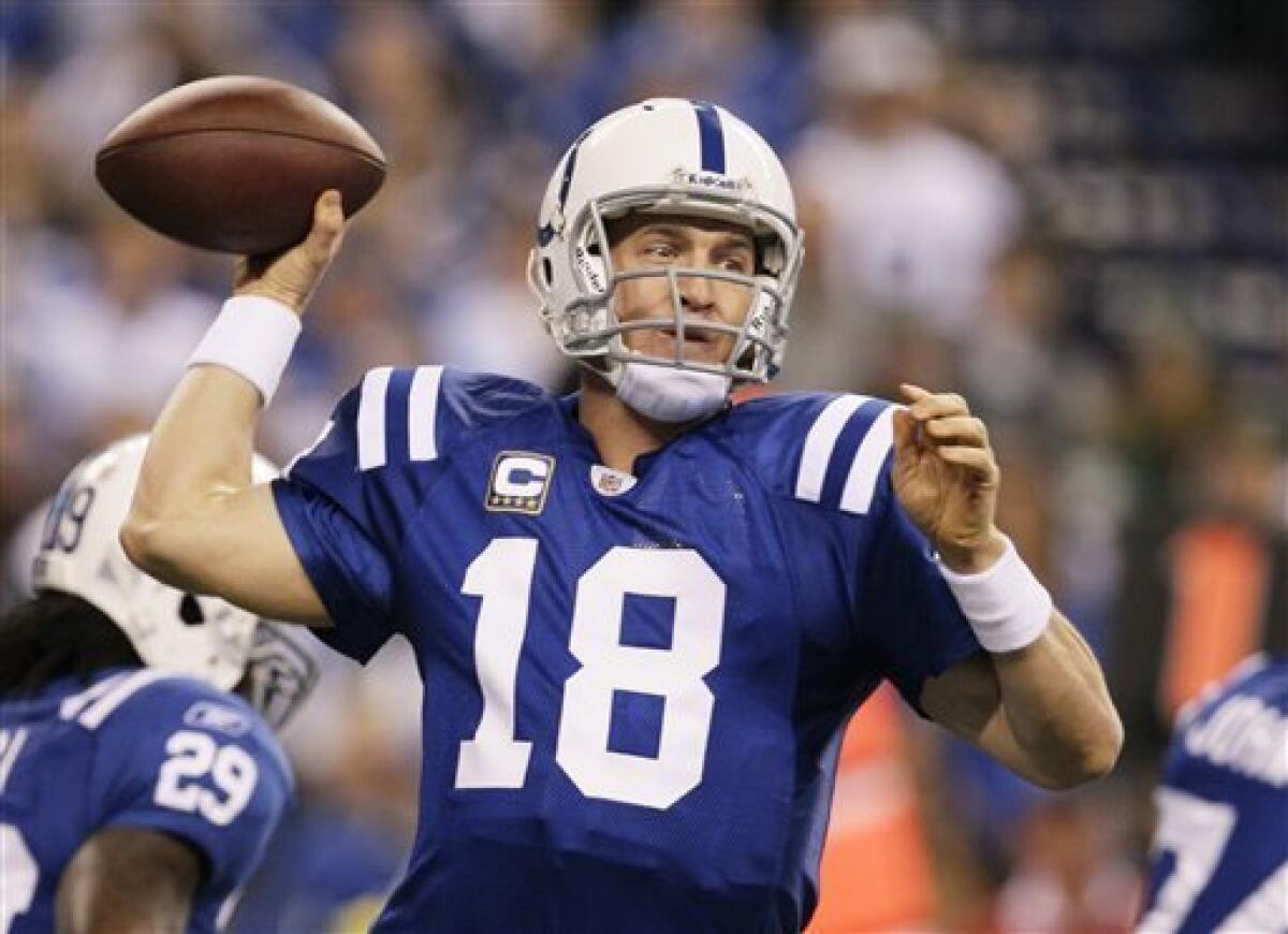 Indianapolis Colts quarterback Peyton Manning (18) completes a