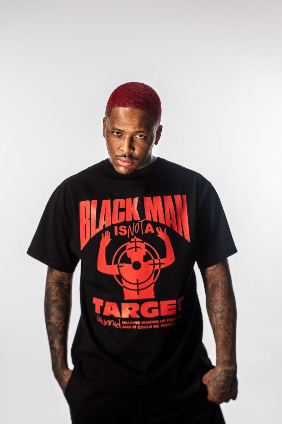  Rapper YG is photographed at his Chatsworth home Sept. 21, 2020, wearing a shirt  saying, "Black Man Is Not a Target."  