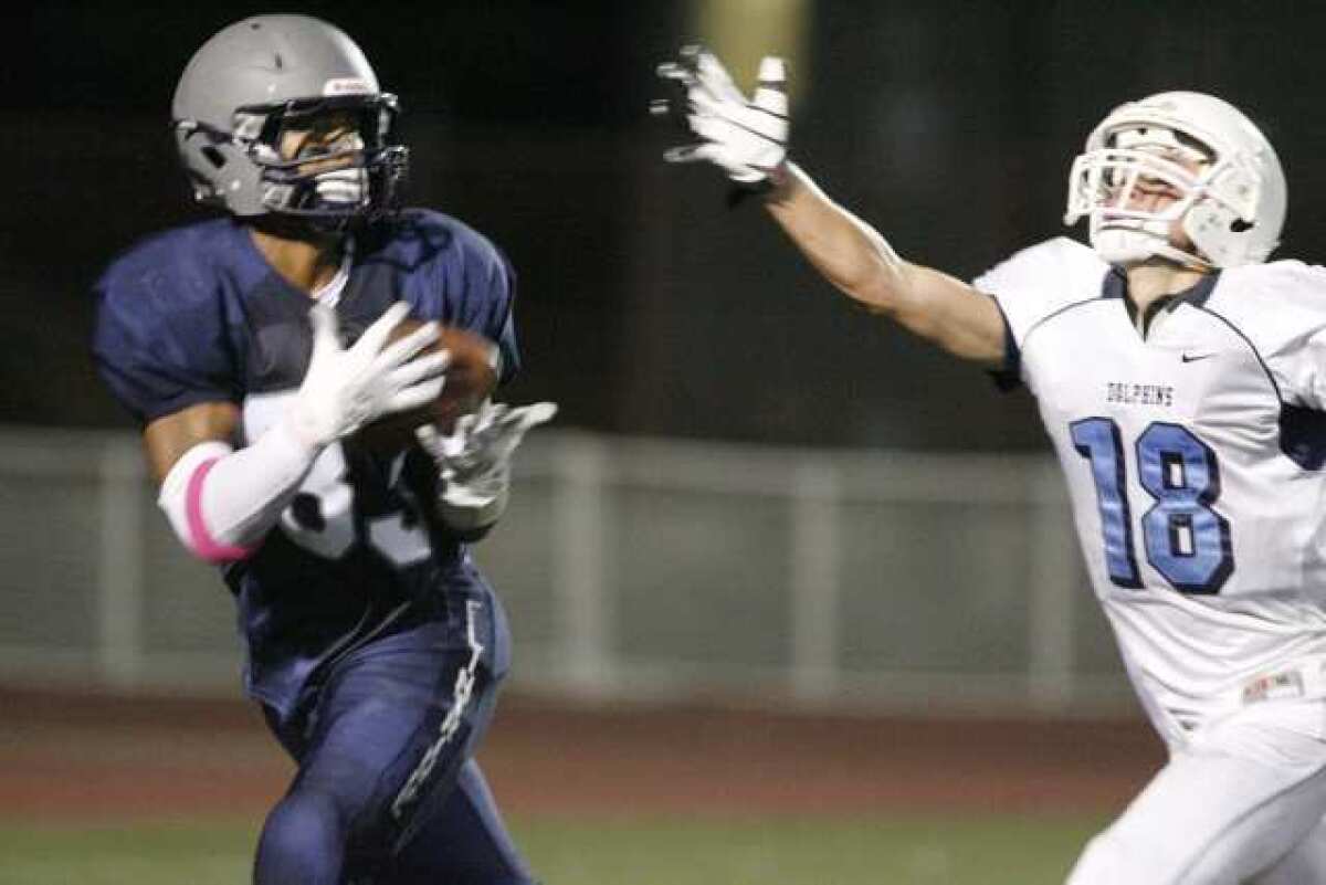 ARCHIVE PHOTO: Flintridge Prep's Chad Cosse, left, hauls in a reception over Chadwick's Cameron Bartlett.