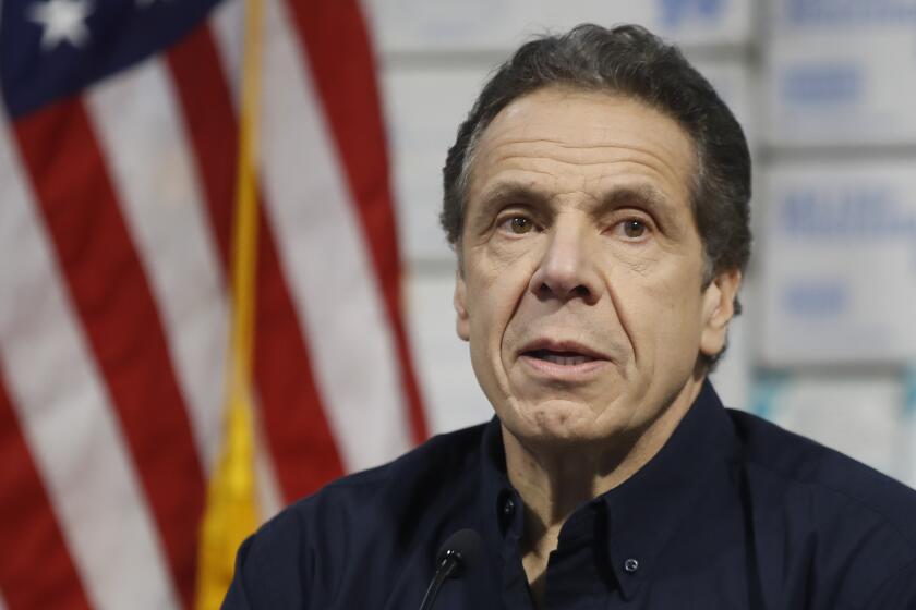 New York Gov. Andrew Cuomo speaks during a news conference at the Jacob Javits Center that will house a temporary hospital in response to the COVID-19 outbreak, Tuesday, March 24, 2020, in New York. (AP Photo/John Minchillo)