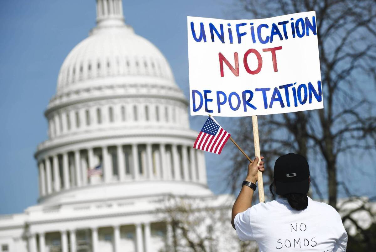 People march in support of immigration reform at the Capitol. Senate negotiators reached a crucial agreement on visas and pay scales for farmworkers.