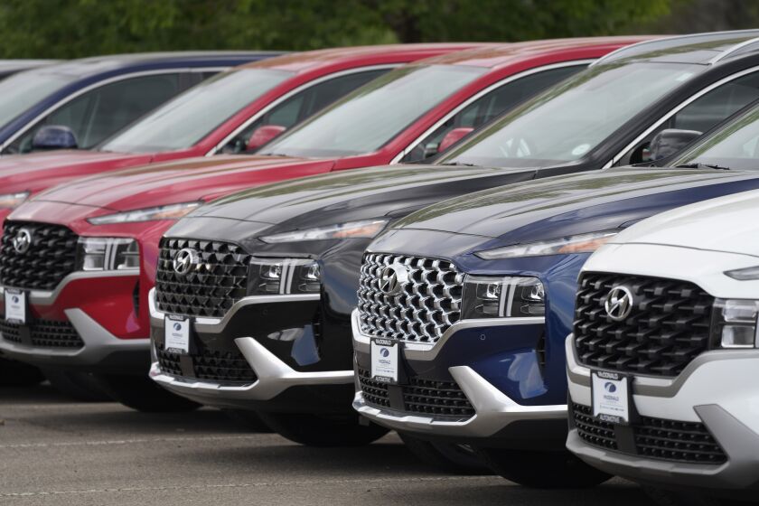 A line of 2022 Santa Fe SUV's sit outside a Hyundai dealership Sunday, Sept. 12, 2021, in Littleton, Colo. Nearly three months after Hyundai and Kia rolled out new software designed to thwart rampant auto thefts, crooks are still driving off with the vehicles at an alarming rate. (AP Photo/David Zalubowski)