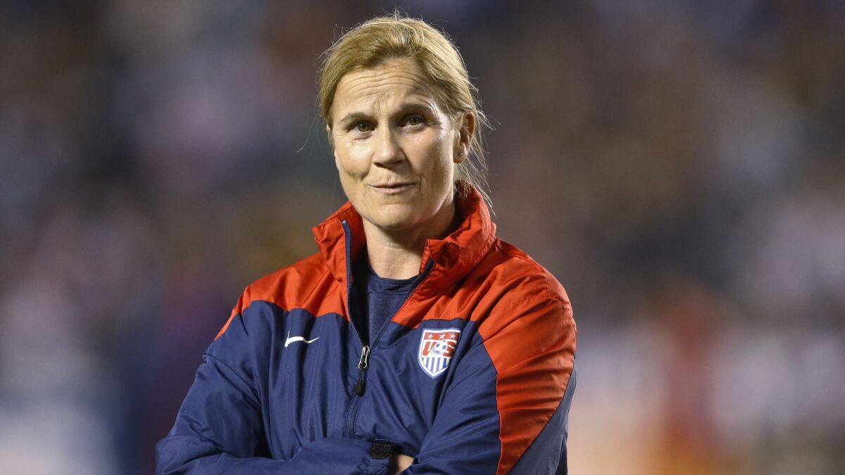 U.S. women's soccer Coach Jill Ellis watches her players warm up for an international friendly match against China in San Diego on April 10, 2014.