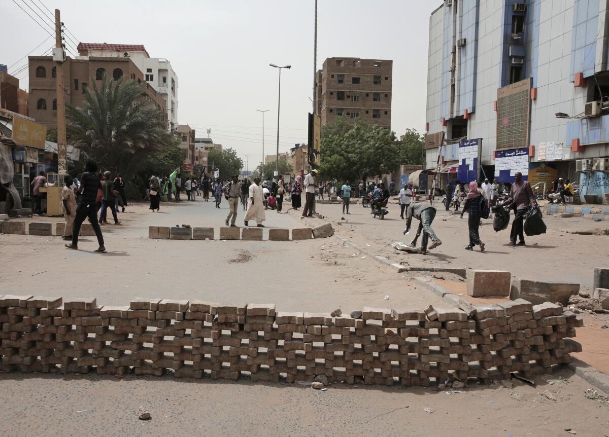 People stage a sit-in demanding a return to civilian rule and to protest the nine people who were killed in anti-military demonstrations last month, in Khartoum, Sudan, Monday, July 4, 2022. (AP Photo/Marwan Ali)