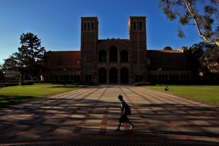 A student walks in the courtyard in front of Royce Hall on the UCLA campus in Westwood on August 7, 2013.