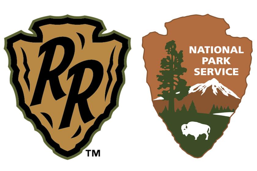 This combo of graphics provided the Glacier Range Riders and the National Parks Service show's the Range Riders arrowhead logo, left, and the NPS's arrowhead logo. The minor league baseball team in Montana is calling out the Department of Interior for “unwarranted and relentless” trademark claims in a battle over the use of an arrowhead logo. (Glacier Range Riders, left, National Parks Service, right, via AP)