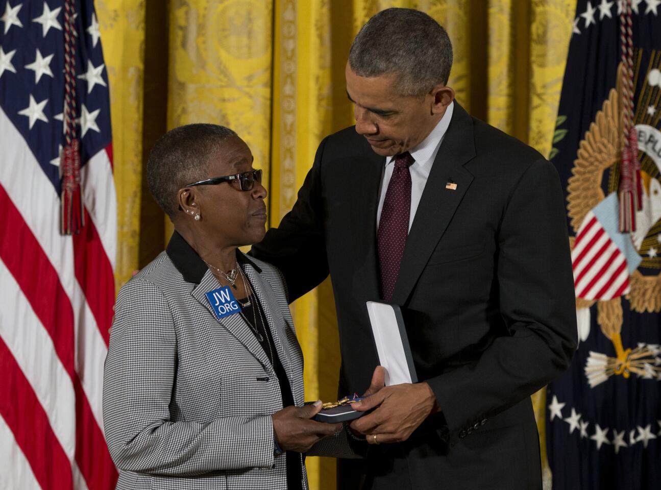 President Barack Obama presents Constance Wilson, grandmother of fallen Philadelphia Police Department Sgt, Robert Wilson III with his Medal of Valor during a ceremony in the East Room of the White House in Washington, Monday, May 16, 2016.