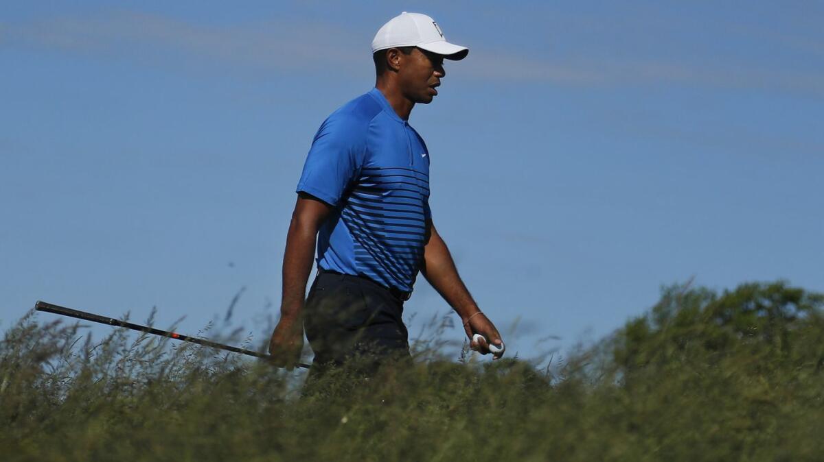 Tiger Woods walks up to the sixth tee during a practice round for the U.S. Open, which begins Thursday in Southampton, N.Y.