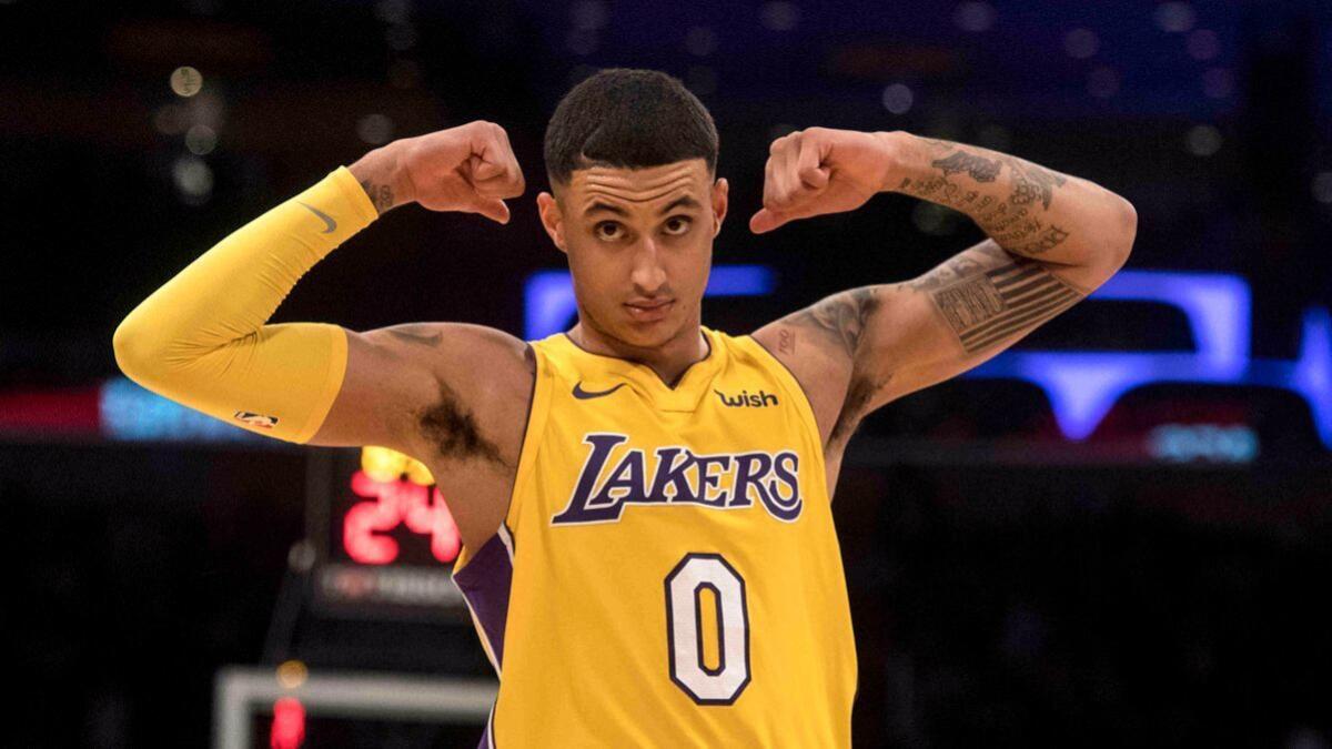 Lakers forward Kyle Kuzma flexes during the second half against the Detroit Pistons on Tuesday.