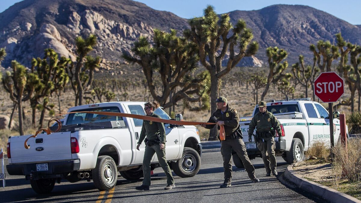 Park rangers close off the access road to a campground at Joshua Tree National Park on Jan. 2.