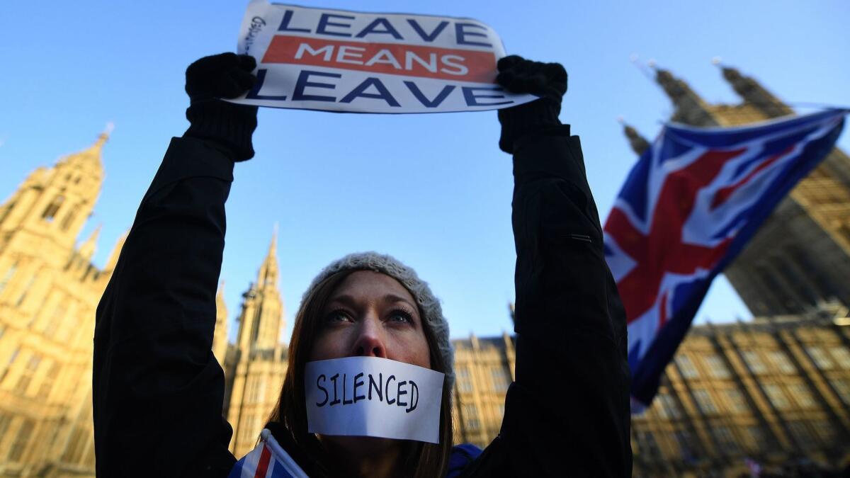 A Brexit supporter protests outside Parliament in London on Tuesday.