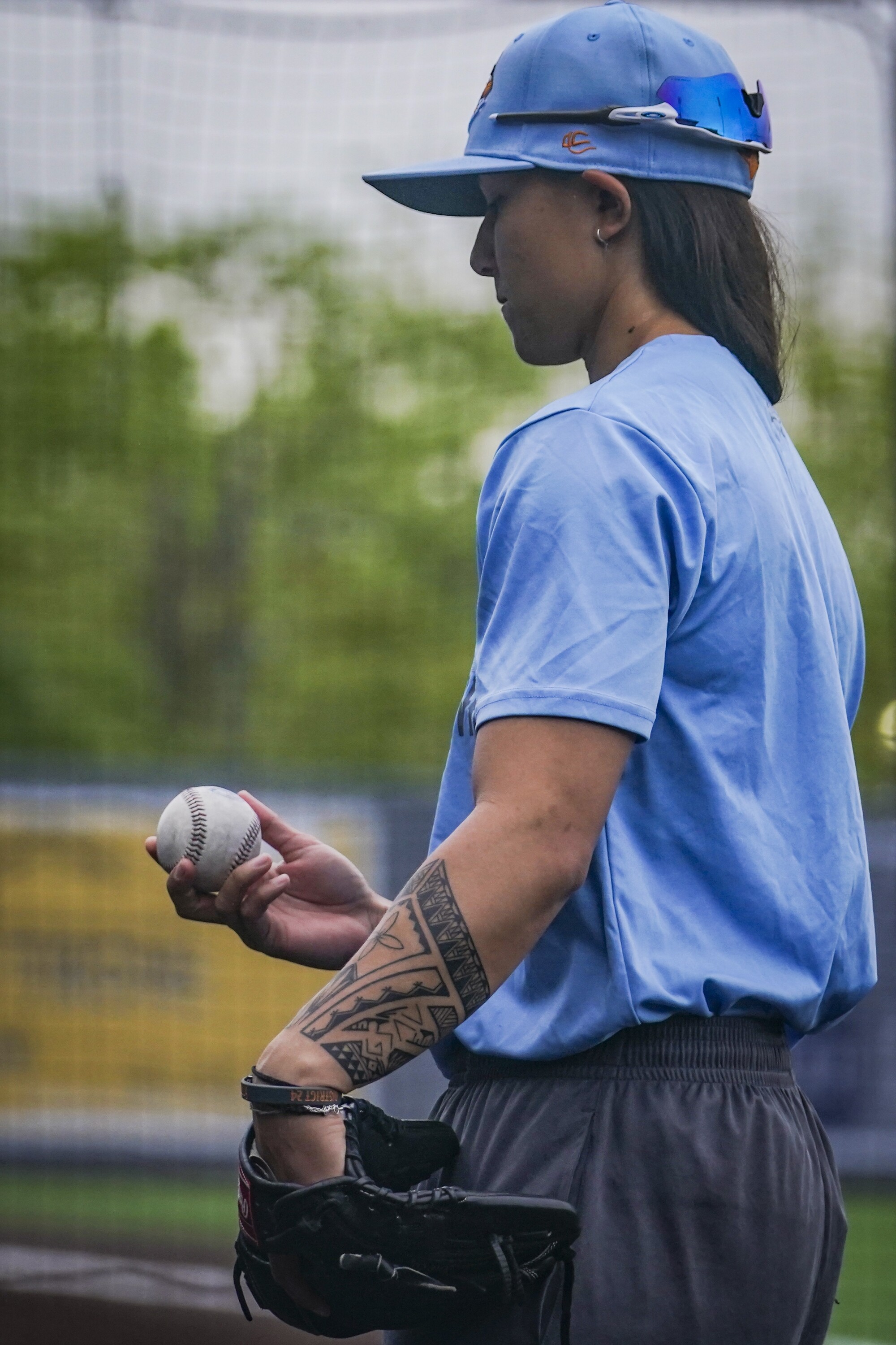 Kelsie Whitmore, a two-way player for the Atlantic League's Staten Island FerryHawks, holds a baseball