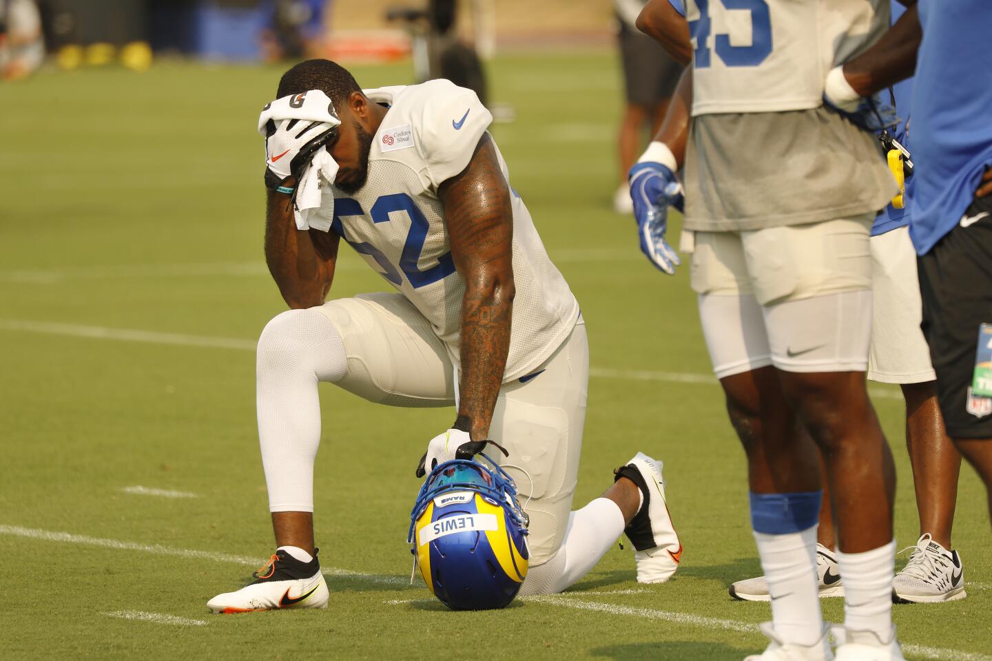 L.A. Rams rookie outside linebacker Terrell Lewis towels away sweat during practice.