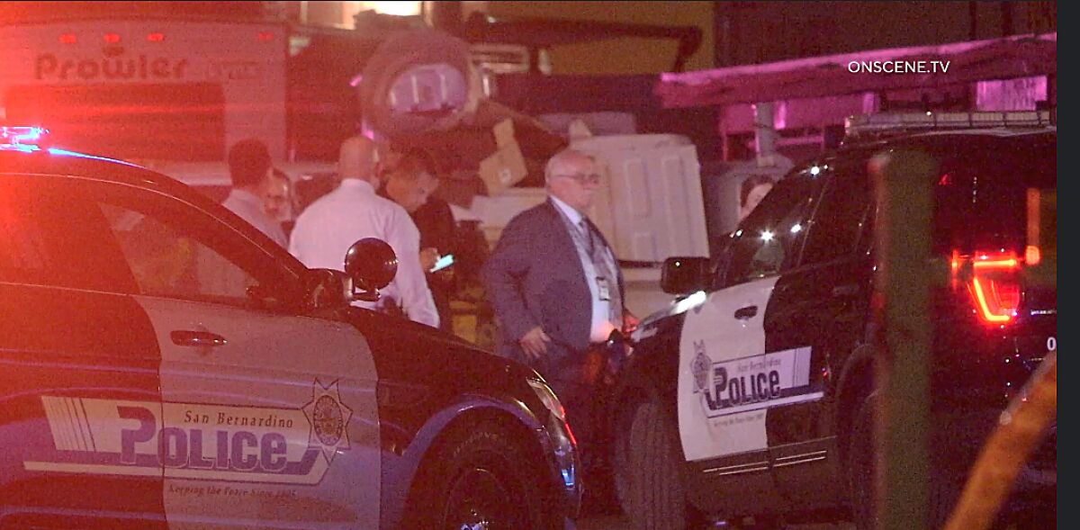 San Bernardino police cars are gathered in an image from video.