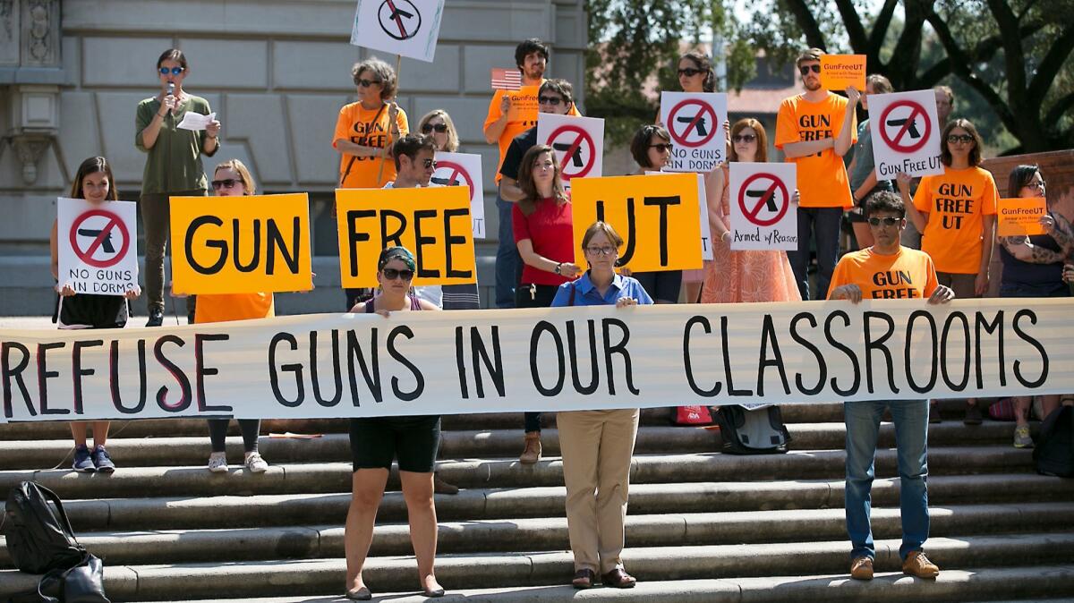 Protesters gather on the University of Texas campus in October of 2015 to oppose a new state law that expands the rights of concealed handgun license holders to carry their weapons on public college campuses.