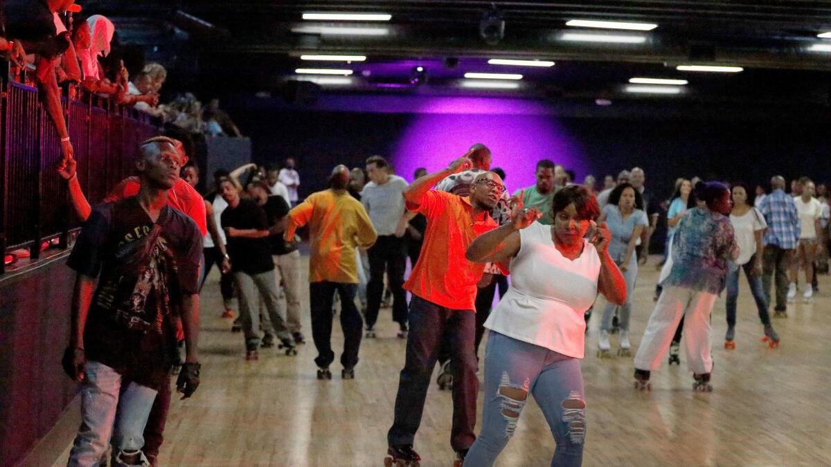 Skaters groove to the music while skating at World on Wheels.