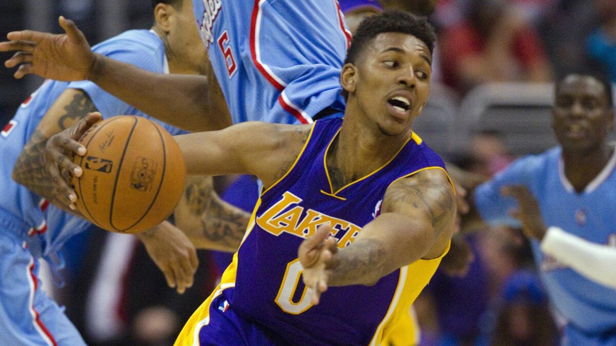 Lakers small forward Nick Young, who averaged a team-best 17.9 points per game last season, re-signed with the team for another four years.