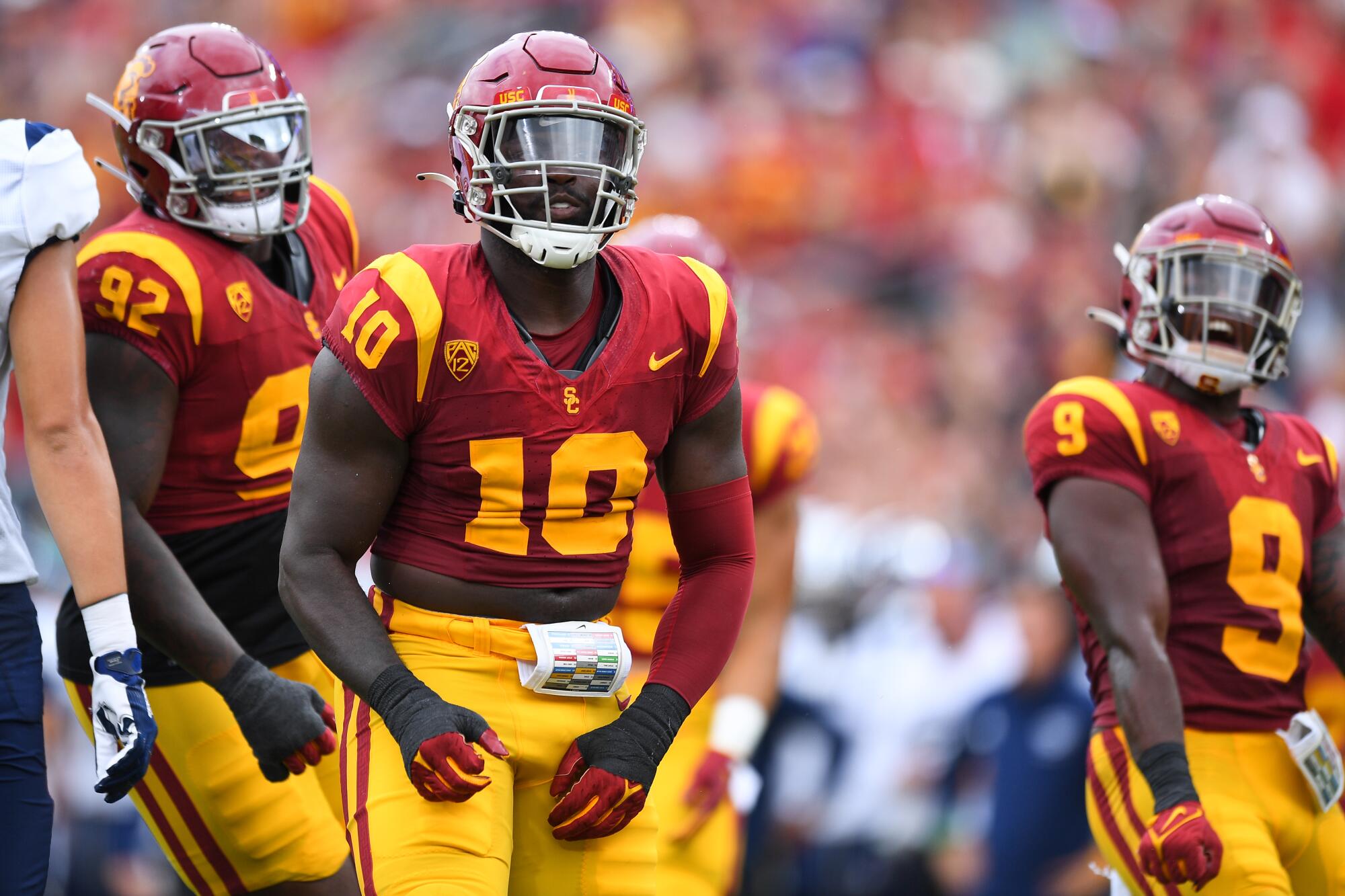 Trojans rush end Jamil Muhammad celebrates after making a tackle during a win over Nevada on Sept. 2.