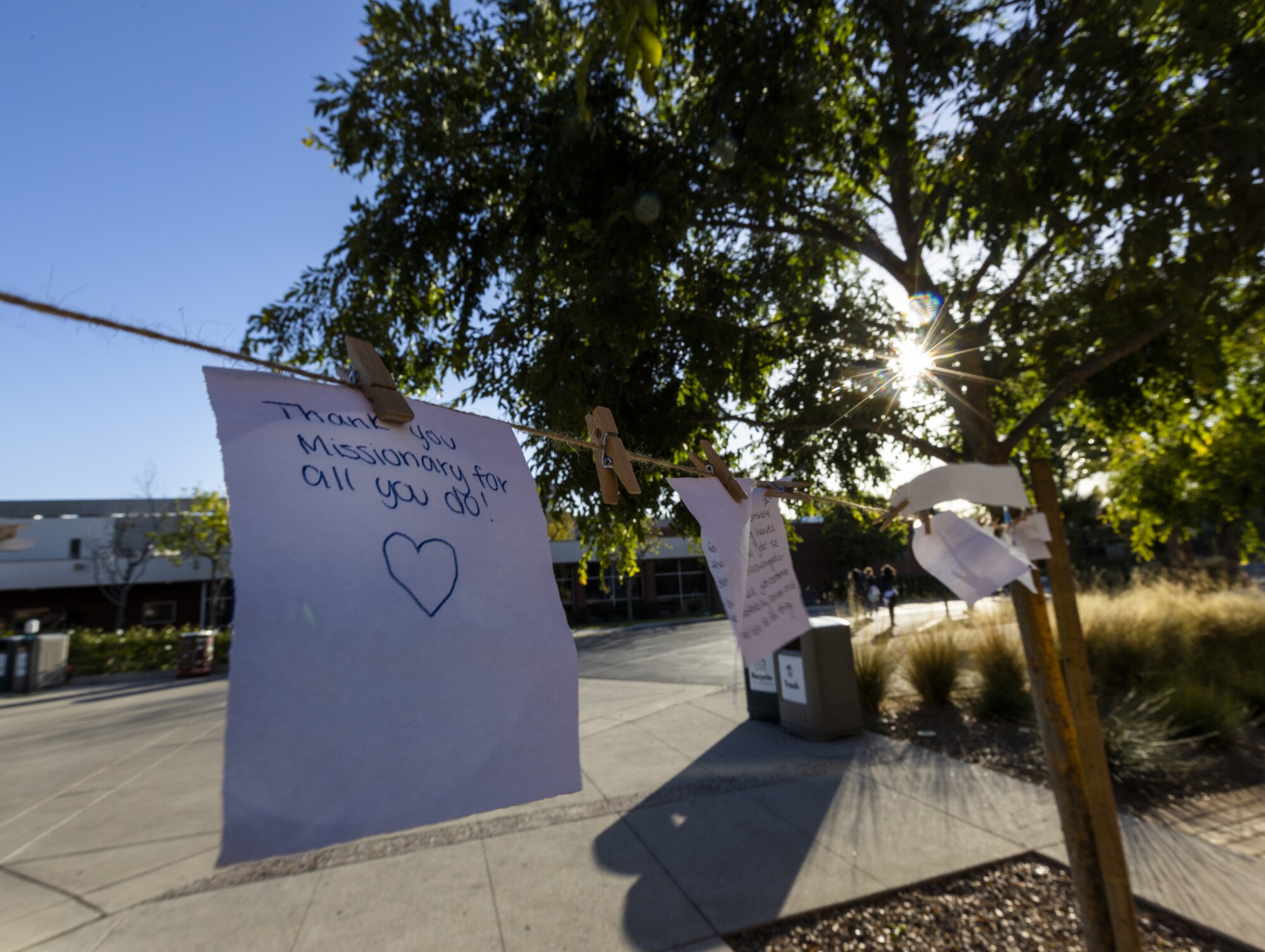Messages hang on a rope on campus.