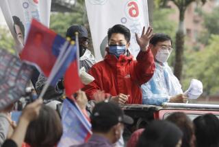 Taiwan's opposition Kuomintang KMT party Taipei city mayoral candidate Wayne Chiang waves to supporters in Taipei, Taiwan, Thursday, Nov. 24, 2022. Taiwan will hold local elections on Nov. 26. (AP Photo/Chiang Ying-ying)