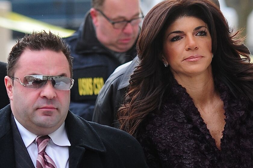 Joe Giudice, with Teresa Giudice outside a federal courthouse in March 2014, welcomed his wife home from prison on Wednesday.