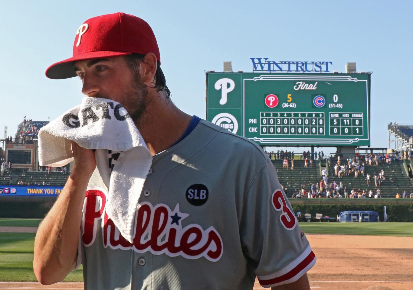Philadelphia Phillies starting pitcher Cole Hamels wipes his face after pitching a no-hitter against the Cubs.