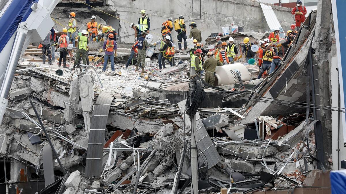 The search continues Sunday for victims buried under the rubble of an office building along Avenida Alvaro Obregon in Mexico City's Roma district.