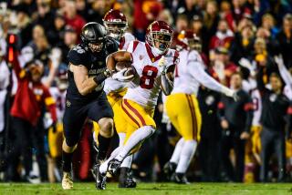 USC receiver Amon-Ra St. Brown (8) scores a touchdown against Colorado during a game Oct. 25 at Folsom Field.