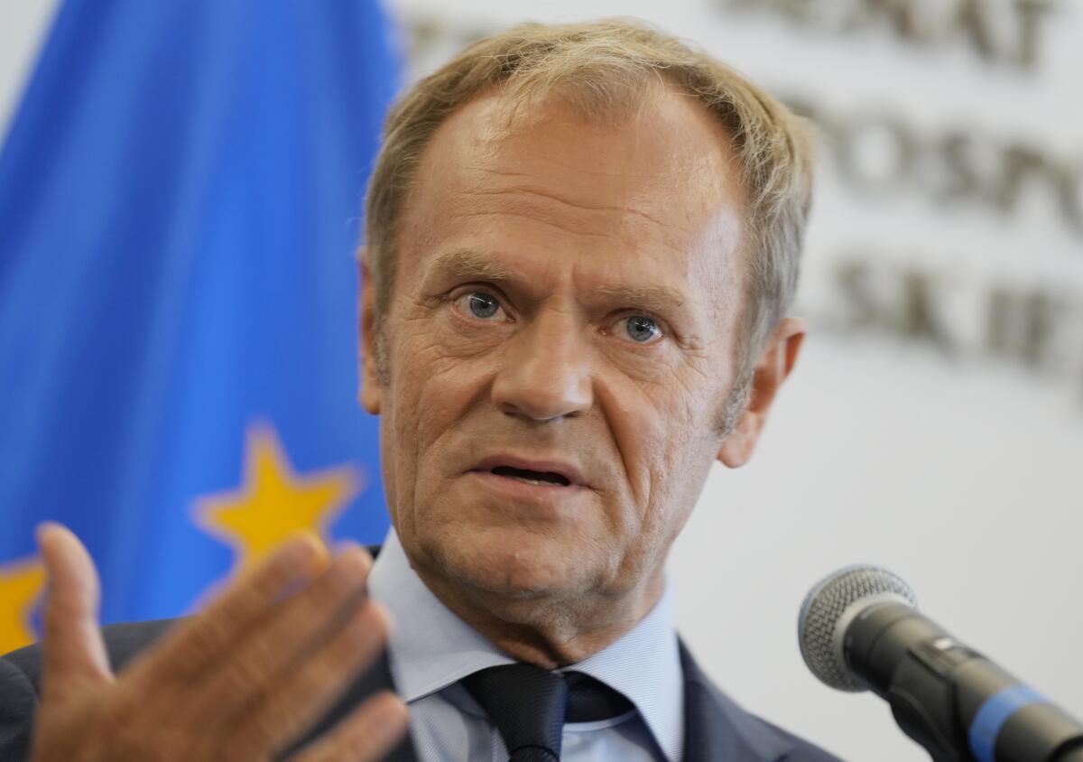 Former European Union head and Poland's ex-prime minister Donald Tusk speaks to journalists following his meeting with a political ally, Senate Speaker Tomasz Grodzki, at the Senate building, in Warsaw, Poland, on Tuesday, July 6, 2021. Tusk recently took leadership of the opposition, vowing to fight the current right-wing government. (AP Photo/Czarek Sokolowski)