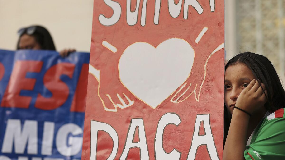 Eileen Lopez, 13, of North Hills, attends a rally calling for action on the future of the DACA program outside City Hall in downtown Los Angeles on Monday, March 5, 2018.