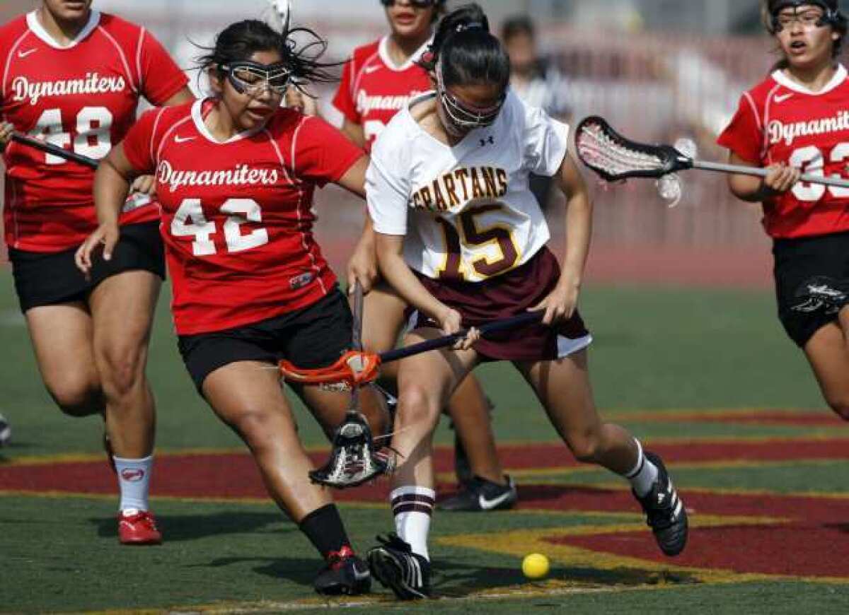 Glendale's Odalis Luna, left, and La Cañada's Christine Noh fight for the ball during a game Tuesday.