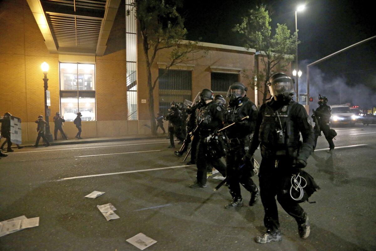 Portland police at the Multnomah County Building on Tuesday.