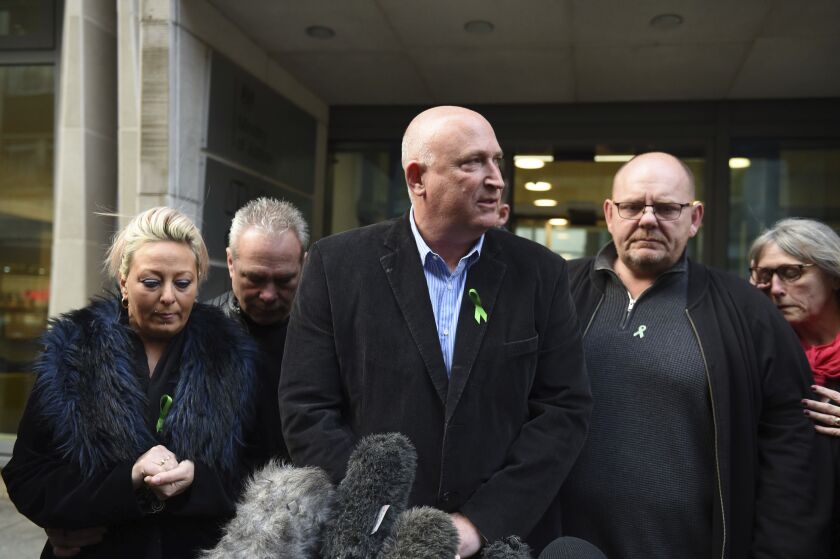 The family of Harry Dunn, from left, mother Charlotte Charles, stepfather Bruce Charles, family spokesman Radd Seiger, father Tim Dunn and stepmother Tracey Dunn speak to the media outside the Ministry of Justice in London on Friday.