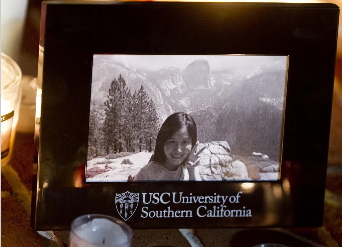 A photo of graduate student Ying Wu is shown at a candlelight memorial vigil in April 2012 at the USC campus in Los Angeles. Wu and fellow student Ming Qu were fatally shot near the campus. On Monday, a Los Angeles County Superior Court judge ruled that Bryan Barnes, 21, and Javier Bolden, 20, will stand trial for the students' murders.