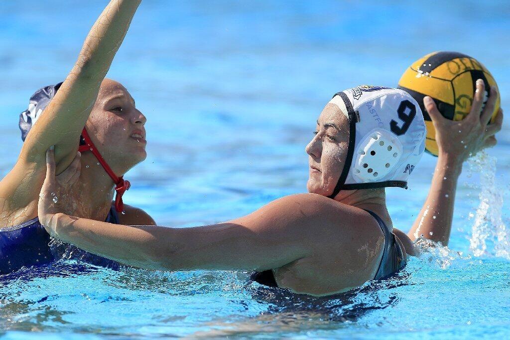 Newport Water Polo Foundation's Kate Pipkin (9) tries to keep United Water Polo Club's Marylynn Cuozzo at arms length as they compete during the second half in a USA Water Polo Junior Olympics match at Capistrano Valley High in Mission Viejo on Thursday.