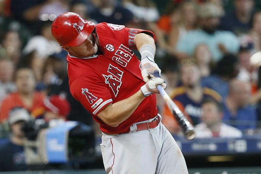 HOUSTON, TEXAS - JULY 07: Mike Trout #27 of the Los Angeles Angels of Anaheim hits a two-run home run in the eighth inning Houston Astros at Minute Maid Park on July 07, 2019 in Houston, Texas. (Photo by Bob Levey/Getty Images) ** OUTS - ELSENT, FPG, CM - OUTS * NM, PH, VA if sourced by CT, LA or MoD **