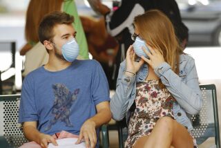 Travis Johnson and Katelyn Markham waited to get antibiotics at San Diego State University's health center on Oct. 17, 2014 after fellow student Sara Stelzer became infected with meningitis B and died. / photo by K.C. Alfred * U-T