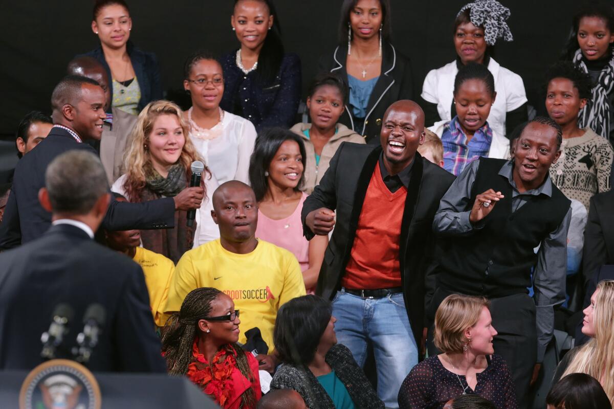 A young man shows his excitement as President Obama calls on him for a question during a "town hall" meeting with the young African leaders at the University of Johannesburg in Soweto on Saturday.