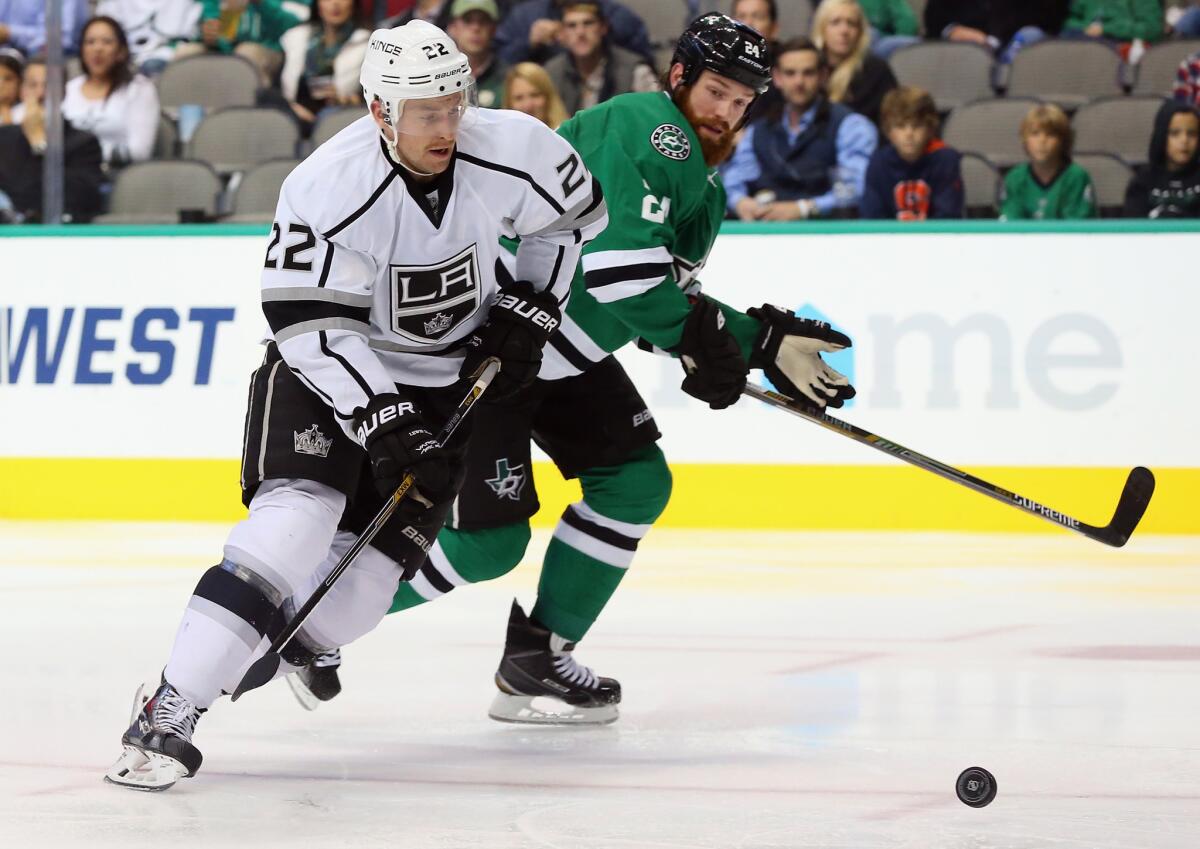 Trevor Lewis passes Dallas' Jordie Benn on his way to scoring a short-handed goal Tuesday at American Airlines Center.
