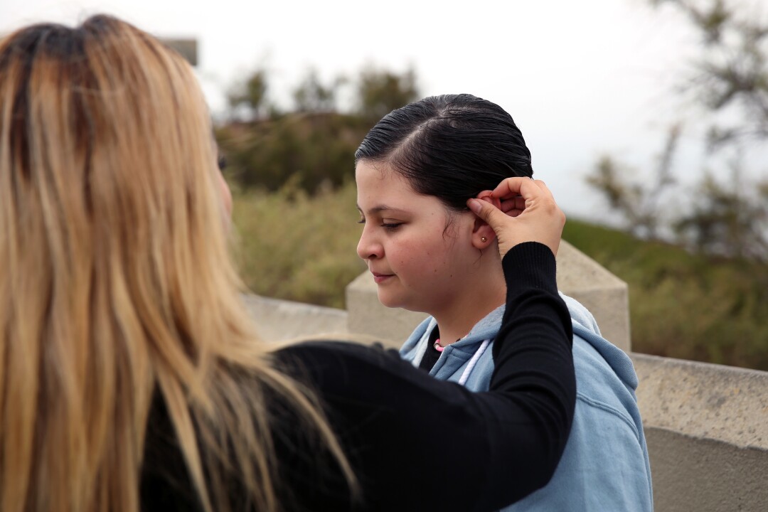  Marlene Diaz brushes the hair from daughter Kayla's face at Point Fermin Park in San Pedro.
