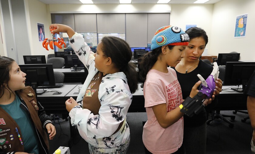 In this 2019 file photo, Girl Scouts learn how to use STEM tools to create gifts for Mother's Day at National University. 