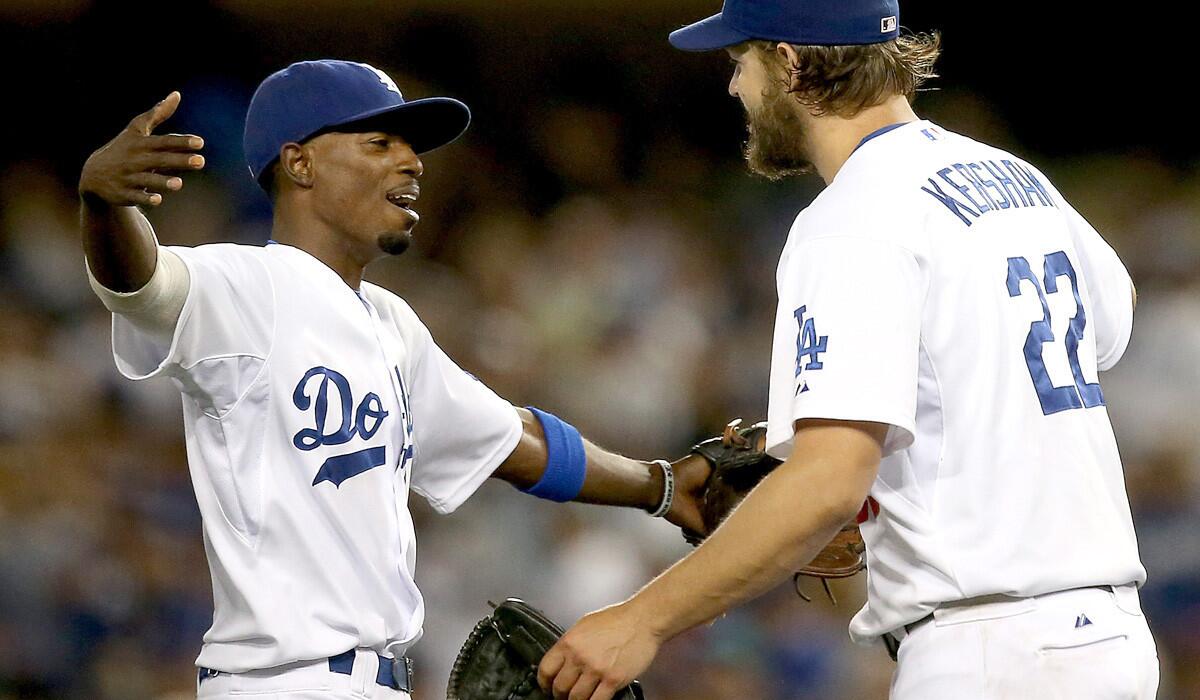 Dodgers second baseman Dee Gordon and ace pitcher Clayton Kershaw, shown after a 2-1 victory over the Padres on Thursday, caught a flight to Minnesota on Sunday evening for the All-Star Game.