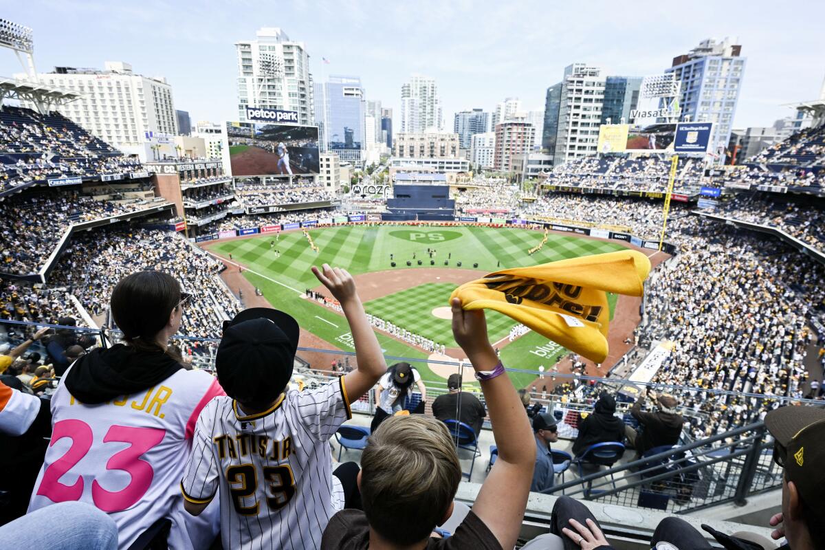 Fans cheer at Petco Park on March 28.